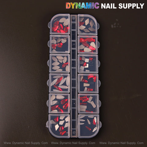 A plastic organizer holds Ruby Red 3 Nail Art Rhinestone Gems in 12 shapes; DYNAMIC NAIL SUPPLY is on top.