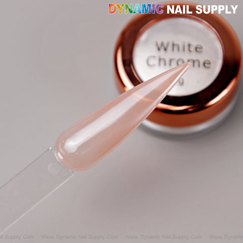 A nail tip with light pink polish is held above Pearl White Transparent Chrome Powder for glazed donut nails.