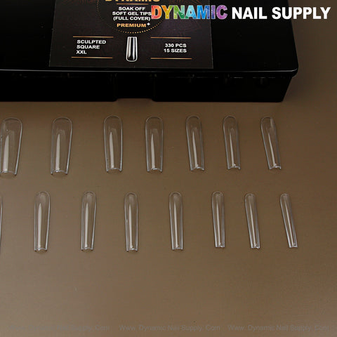 Sculpted Square (XXL) Soft-Gel Nail Tips, 15 pcs, full cover in black box on brown surface.