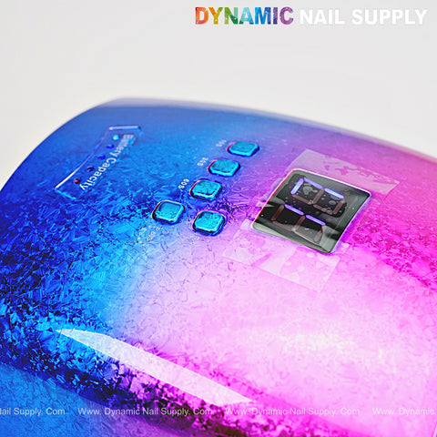 The [Rainbow] Cordless 48W LED/UV Gel Nail Dryer has a chrome pink-blue finish, timer, display, and Dynamic Nail Supply logo.