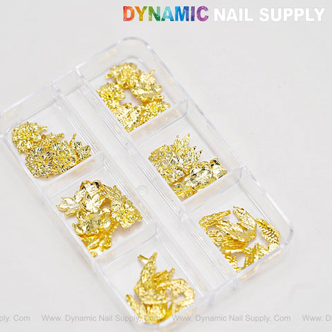 A clear box holds Gold Flowers and Wings Charms for Nail Art; DYNAMIC NAIL SUPPLY is printed at the top.