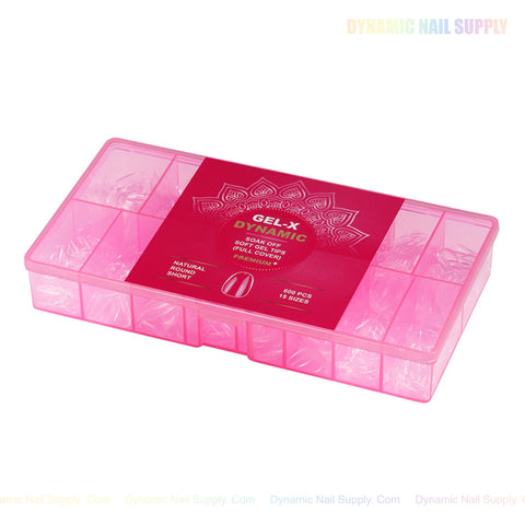 A pink box labeled “Natural Round (Short) Full Cover Soft-Gel Nail Tips” with soft gel tips inside.