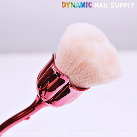 The [Metal Pink] Rose Nail Dust Cleaner Brush is perfect for dust and dip powder cleanup by Dynamic Nail Supply.