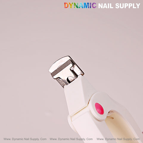 White Nail Tip Cutter With Measure Spacers, pink button, angled up, on pale background with DYNAMIC NAIL SUPPLY text.