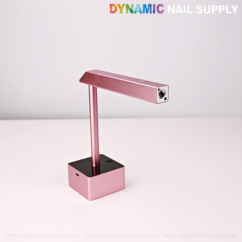 The 2 in 1 Mini UV/LED Flash Cure Lamp by Dynamic Nail Supply quickly cures gel polish for manis and pedis.