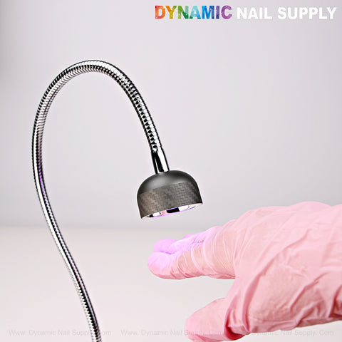 A gloved hand under the Long Goose Neck Flash Cure Cordless UV LED Lamp with DYNAMIC NAIL SUPPLY text above.