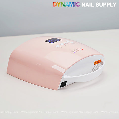 Stawberry Pink Cordless 48W Gel Nail Dryer with digital display, on white under DYNAMIC NAIL SUPPLY text.