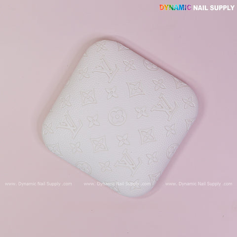 The White LV Engrave - Grain Elbow Rest Pad is a PU leather, textured cushion for nail techs, perfect for long use.