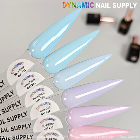 Five long pastel blue and lavender nails, No-HEMA Gel Polish 231–240, with bottles in the background.