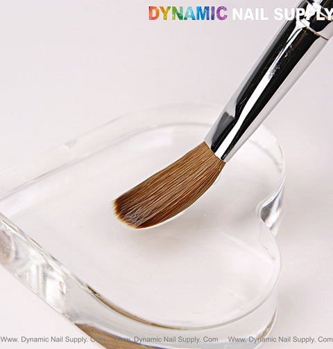 A [Crimped] Size 16 Dynamic Kolinsky Brush sits on a heart-shaped palette, set against a white background.