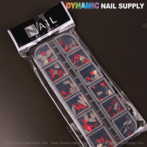 [Ruby Red 3] features assorted nail art rhinestones in 12 shapes—raindrop, square, heart, moon—by Dynamic Nail Supply.