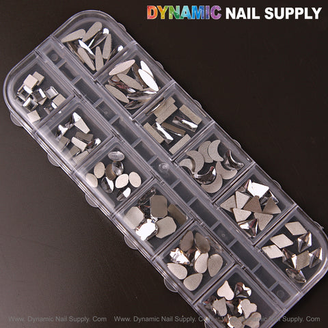[Silver 3] Mixed 12 shapes nail art rhinestone gems in a divided case on a dark background.