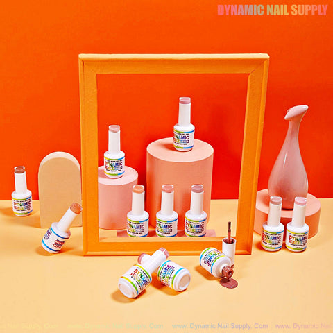 BIAB Rubber Base Nude Color Builder Gel Polish 01–12, arranged with peach props on a vibrant peach-orange background.