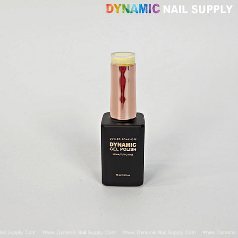 A bottle of Dynamic No-HEMA Gel Polish (Color 221-230) with a black base, rose gold cap, on a plain light background.