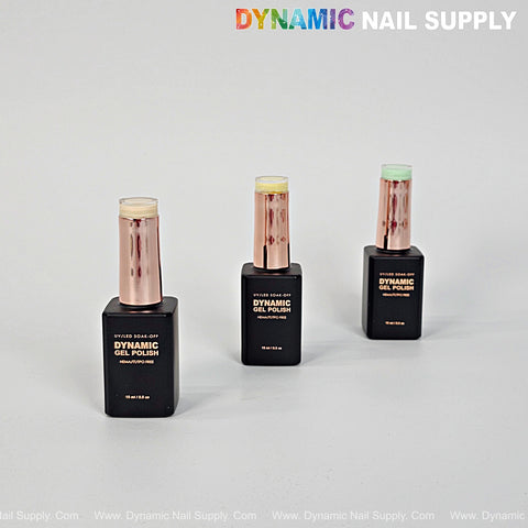 Three bottles of Dynamic No-HEMA Gel Polish (Color 221-230) stand on a light gray surface with the brand logo above.