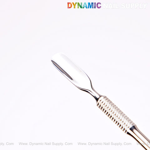 The NT1234 Professional Double-Function Cuticle Pusher, stainless steel with a textured handle, shown on white.