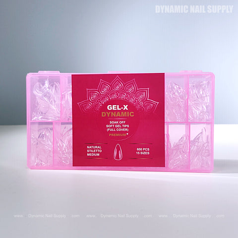 A pink box labeled Natural Stiletto (Medium) holds clear Full Cover Soft-Gel Nail Tips, sorted by size.