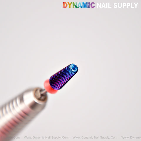 A close-up of the 5-in-1 Fine Cross Cut Drill Bit (Blue) by Dynamic Nail Supply, held by a silver tool.