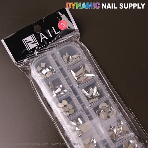 A plastic case holds Silver 3 Mixed 12 Raindrop, Square, Heart, Moon Nail Art Rhinestone Gems by Dynamic Nail Supply.