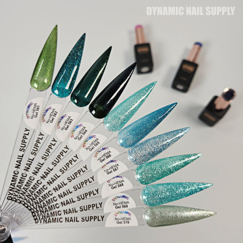 A fan of green and blue Dynamic No-HEMA Gel Polish (Color 561–570), bottles blurred in the background.