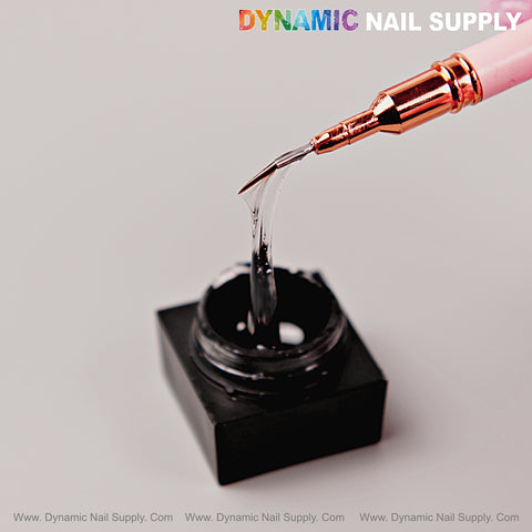 A nail brush lifts No-wipe Ready for Chrome Spider Gel; “DYNAMIC NAIL SUPPLY” appears above in colorful text.