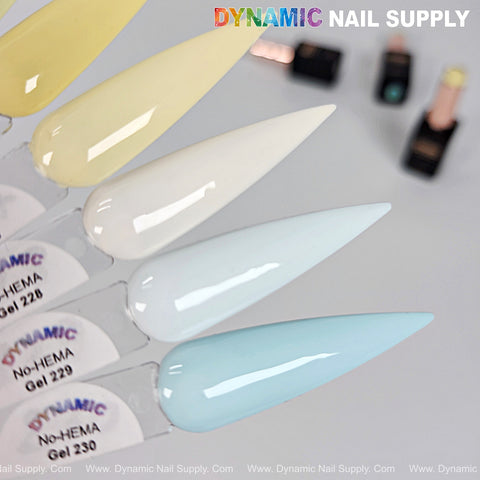Four Dynamic No-HEMA Gel Polish samples (Colors 221–230) in pale yellow, cream, white & light blue on labeled swatches.