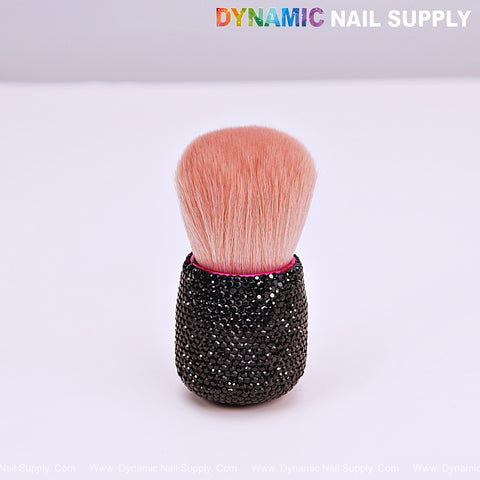 The RB10 Black Rhinestone Small Dust Brush stands upright, perfect for cleaning up acrylic nails and powder remover.