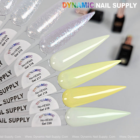 Six nail swatches display glittery white, pearl, and pale yellow Dynamic No-HEMA Gel Polish, Colors 211–220.