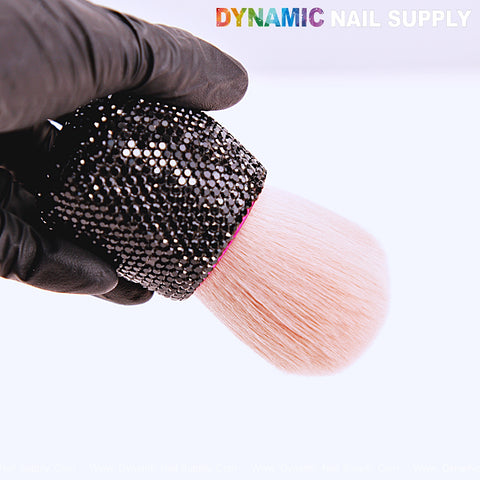 A gloved hand holds the RB10 Black Rhinestone Small Dust Brush, a cleaning tool for acrylic nails powder remover.