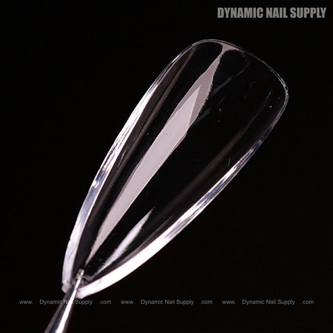 A Natural Stiletto (Medium) Full Cover Soft-Gel Nail Tip (Pink Box) shown on a black background with branding in the corner.