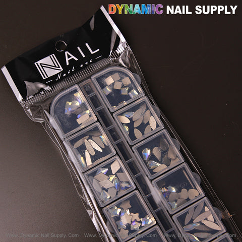 A package of Crystal Blue AB 6 mixed shape rhinestone gems by Dynamic Nail Supply on a dark surface.