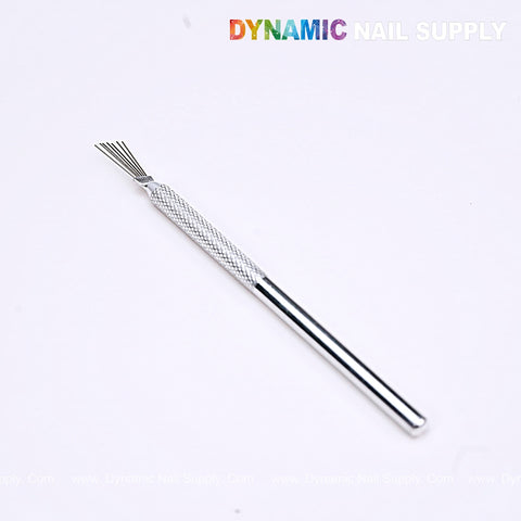 The Nail Art Manicure Stainless Steel Brush features a textured grip and fine bristles for detailed nail art designs.