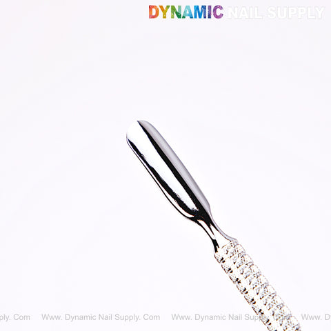 NT1230 – Professional Double-Function Cuticle Pusher (Knife and Spoon) by Dynamic Nail Supply with textured handle.
