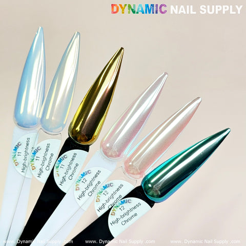 A close-up of five nail samples highlights the iridescent chrome finishes in silver, gold, bronze, pink, and teal. Each sample is labeled with "Light-Pearl Transparent Iridescent Chrome #12 - High brightness Fine Pigment Powder." The simple background accentuates the enchanting chrome effect above the Dynamic Nail Supply text.
