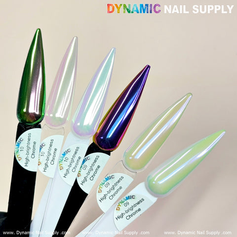 Five elongated, almond-shaped nail samples exhibit a captivating nail art design using Light-Mermaid Iridescent Chrome #10 from Dynamic Nail Supply. The iridescent colors transition beautifully between green and purple, with labels numbered 02 to 06. The neutral background highlights the brilliance of the high-brightness chrome effect.