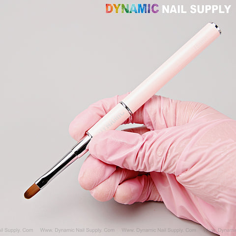 A gloved hand holds the Silver Pink Builder Gel Hard Gel Dual Head Round Brush; Dynamic Nail Supply text at top right.