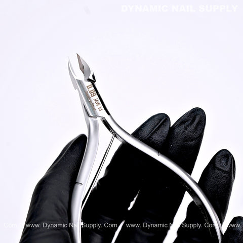 A hand in a black glove holds D09 - Jaw 14 Cuticle Clippers with Grip Control against a white background.