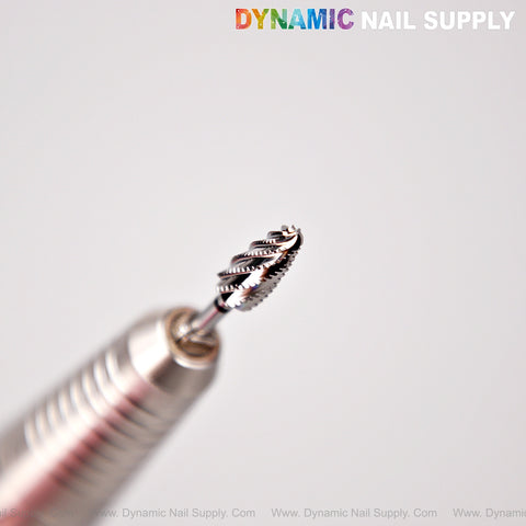 Extra Coarse XC Premium Cross Cut Typhoon Bit in handpiece, showing spiral design for smooth professional debulking.