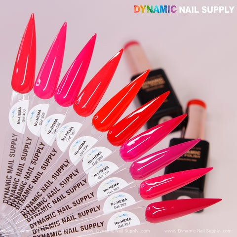 Nine vivid stiletto nail swatches fan out by Dynamic No-HEMA Gel Polish 391–400, Pretty Red Collection, for allergy-safe nails.