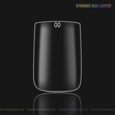 A single clear Natural Square (Short) Full Cover Soft-Gel Nail Tip labeled 00, pink box, from DYNAMIC NAIL SUPPLY.