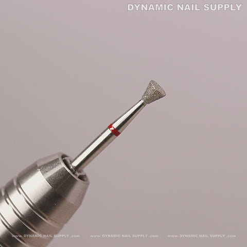 Close-up of the Inverted Corn Diamond Fine Cuticle Bit for dead skin, nail prep, and under-nail cleaning on pink.