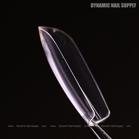 A Sculpted Square (Medium) Soft-Gel Nail Tip held by tweezers; DYNAMIC NAIL SUPPLY text appears in gray.