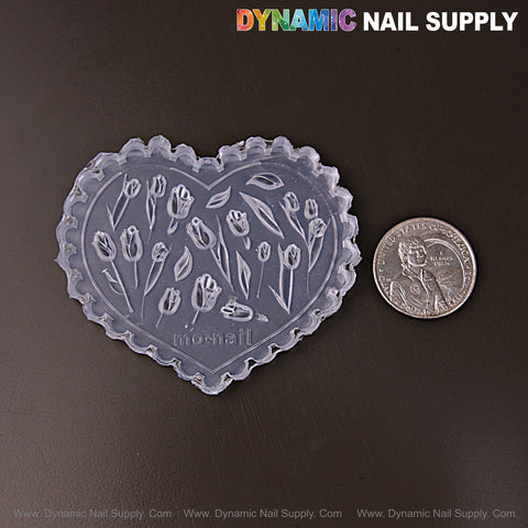 MIxed Size Tulips 3D Nail Art Silicone Charm Mold shown with a U.S. quarter for size on a dark surface.