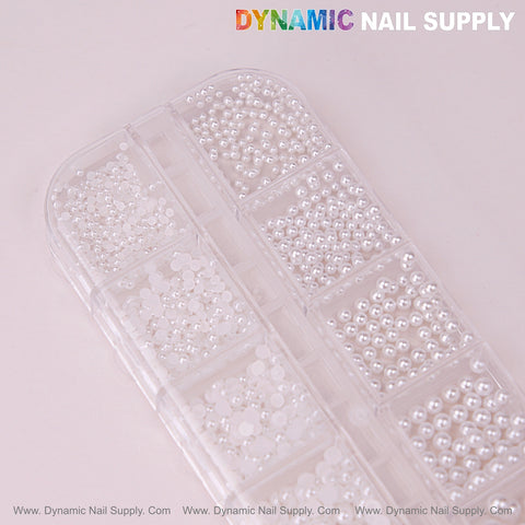 12 grid White Pearl Beads Nail Charms in mixed sizes, round flatback stones in a clear case on a pink background.