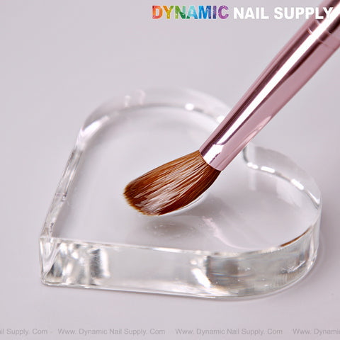 Dynamic Metallic Pink 100% Kolinsky Hair Brush rests on a clear heart-shaped palette; DYNAMIC NAIL SUPPLY above.