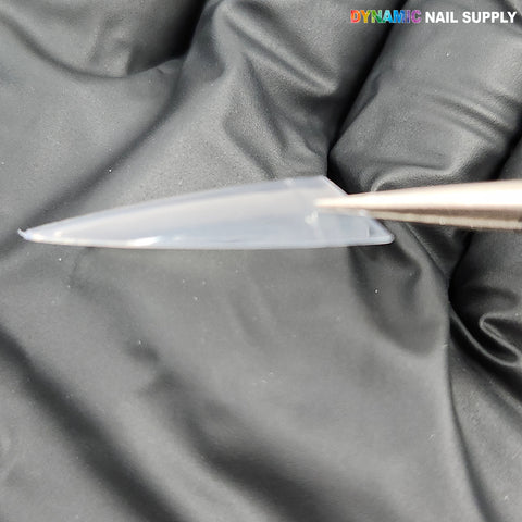 A gloved hand holds a Medium Almond Extension Nail Tip; (New 2026) label is in the top right corner.