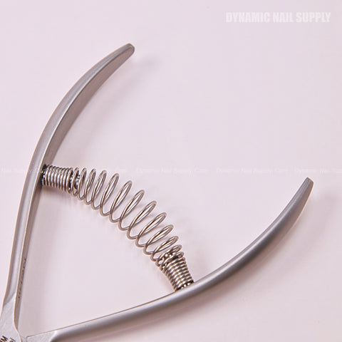 Close-up of CL.S01 5MM Professional Cuticle Nippers with spiral springs, stainless steel handle on pink background.