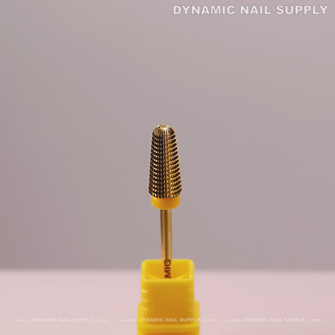 The Extra Fine 5-in-1 Volcano Bit stands upright in a yellow holder, perfect for smoothing acrylic or gel nails.