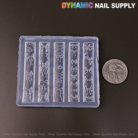 The Mixed Style Bow Charms 3D Silicone Mold for nail art is shown beside a U.S. quarter to show its size.
