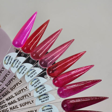 Dynamic No-HEMA Gel Polish 411-420: 8 red shimmer samples on clear swatches, safe for sensitive nails.